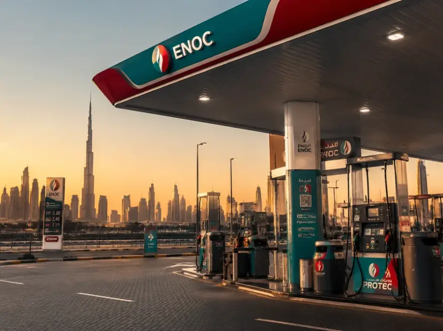 Petrol price in Dubai — ENOC fuel station with downtown skyline in background