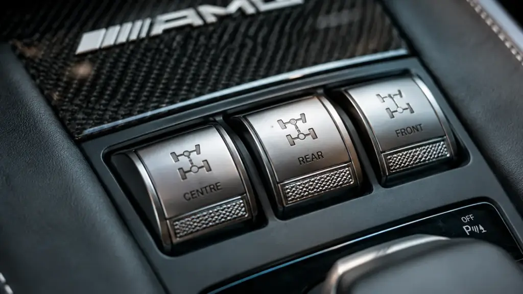 Mercedes-AMG G63 centre console showing the three silver locking differential buttons.